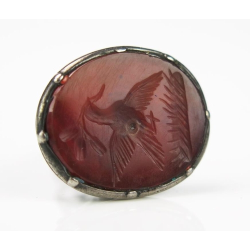 756 - A late 18th Century Silver and Carnelian Fob Seal, a flying dove holding a sprig, 29x21x18mm, 5.6g t... 