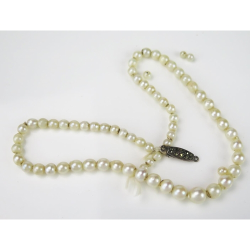 804 - A Graduated String of Misshapen Pearls, untested, largest c.7mm, 325mm approximately long, silver cl... 