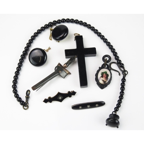 805 - A Group of Antique Obsidian and Jet Jewellery, to include two black enamel bar brooches, a crucifix,... 