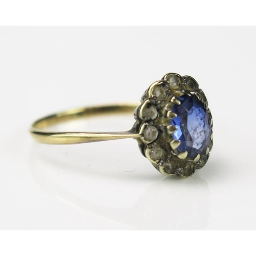 832 - A Blue and White Stone Cluster Ring, unclear stamped marks 9 or 18ct, 11x10mm head, size O, 1.9g