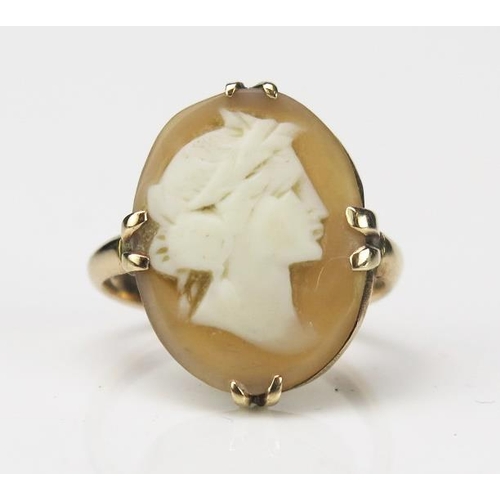 834 - An Antique Yellow Metal Cameo Ring, the cameo of a classic woman's head, not marked, ring size E, 3.... 