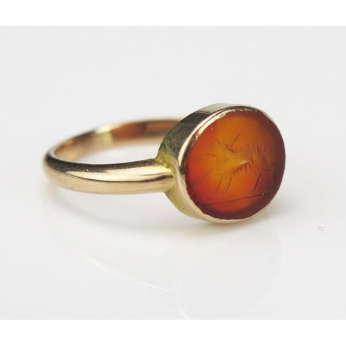 835 - An Antique Rose Gold and Engraved Carnelian Seal Ring, in the Roman Style, not marked, the oval ston... 