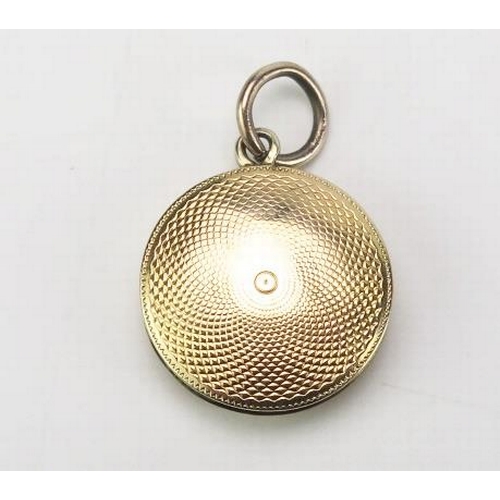 857 - Antique Gold Pendant Mourning Locket, of circular form, with engine turned decoration, the hinge lid... 