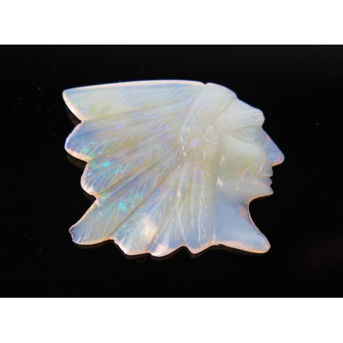 891 - A Carved Opal of a Native American Chief, in head dress, 20x25mm.