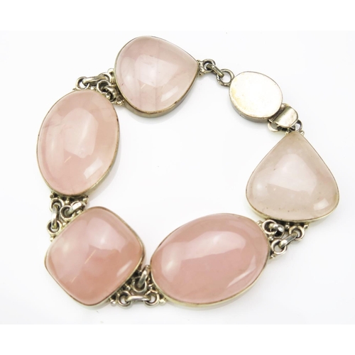 901 - A Silver and Rose Quartz Bracelet, stamped 925, 190mm long, 62.1g total.