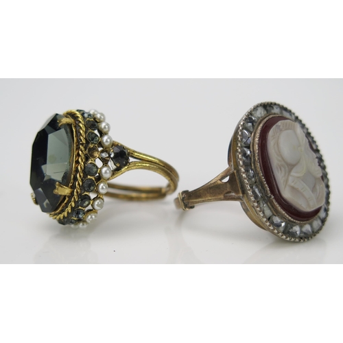 903 - A Carved Cameo Dress Ring, of a classical knight surrounded by foil wrapped white stones, together w... 