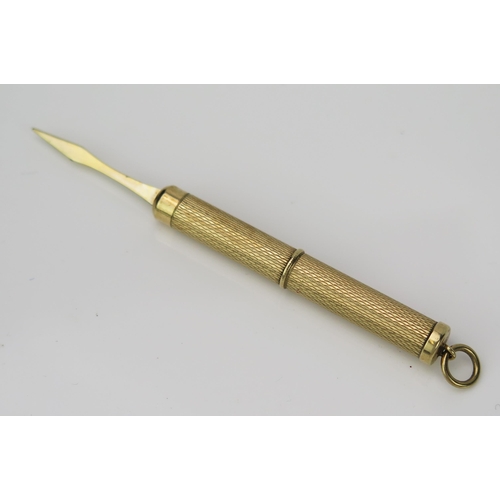 904 - A 9ct Gold Tooth Pick, with engine turned decoration, 5.5cm long 6.7g.