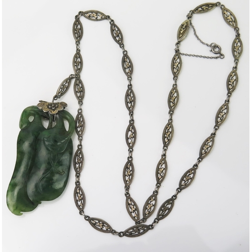 906 - A Chinese Jadeite and Silver Pendant and Chain,  carved as two aubergines / eggplants, on a lozenge ... 