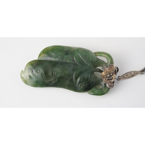 906 - A Chinese Jadeite and Silver Pendant and Chain,  carved as two aubergines / eggplants, on a lozenge ... 