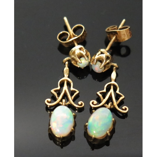 912 - A Pair of Antique Style Opal and 9ct Gold Earring Drops, for pierced ears, hallmarked, large oval be... 