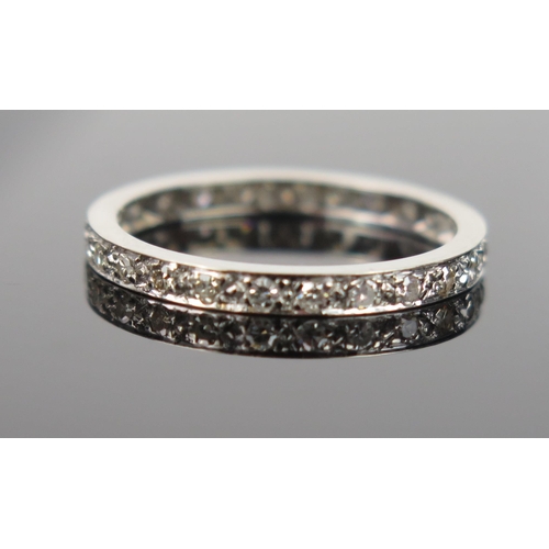 946 - A Diamond and Precious White Metal Eternity Ring, very small diamonds claw mount setting, not marked... 