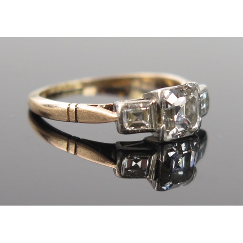 952 - An Art Deco Diamond Three Stone Ring, central stone 6x5.5mm approximately, flanked by two smaller, i... 