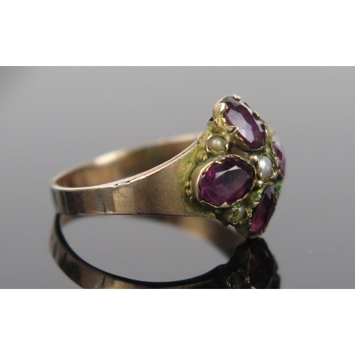 954 - An Early 19th Century Yellow Metal, untested Seed Pearl and Amethyst Ring, size N.5, 2.2g