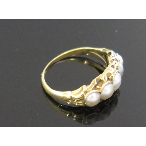 961 - An Antique Split Pearl Ring in a high carat unmarked gold setting, size K, 3.3g