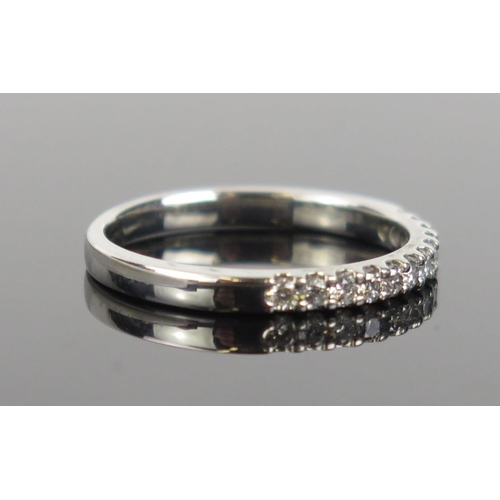 971 - A Diamond and Platinum Half Eternity Ring, stamped 950 and 0.25, ring size N, 3.5g total.