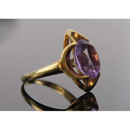 972 - An Amethyst and 14ct Gold Cocktail Ring, central oval stone 9x11mm approximately, ring size M/N, 4.1... 