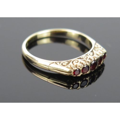 986 - A 9ct Gold and Garnet Five Stone Ring, size P, 3g