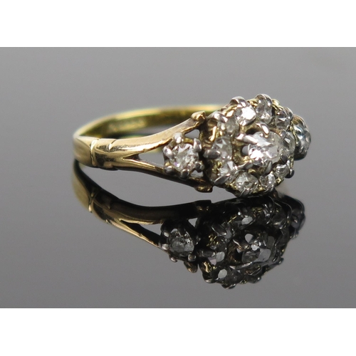 988 - A Diamond and 18ct Gold Cluster Ring, central stone 0.125ct approximately, stamped, ring size L, 2.8... 