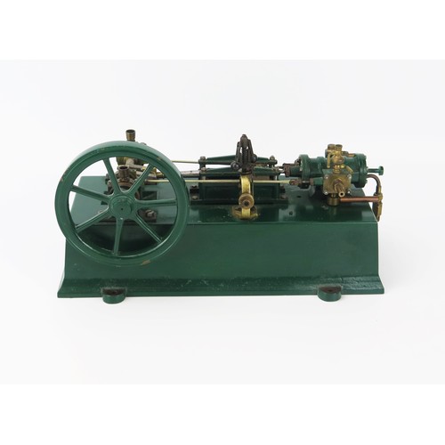 2589 - A Live Steam Plant, with single cylinder with spoked flywheel, painted in bottle green with rectangu... 