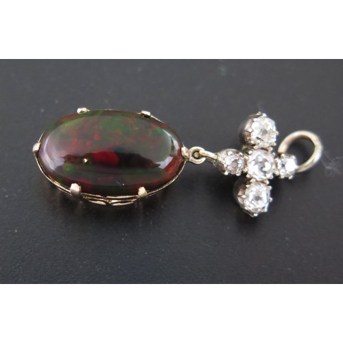 1062 - An Opal and Diamond Pendant, the diamond cross suspension above an oval opal 16x10mm approximately, ... 