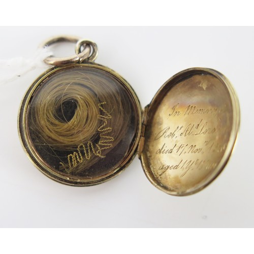 857 - Antique Gold Pendant Mourning Locket, of circular form, with engine turned decoration, the hinge lid... 