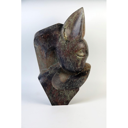 1230 - Brighton Sango (1958-1995), abstract sculpture of a fawn, serpentine stone, 38cm.