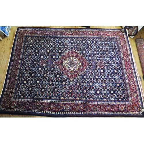 1336 - A Persian Mood carpet, with central field with ivory and wine red pole medallion and all over flower... 