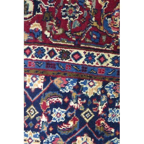 1336 - A Persian Mood carpet, with central field with ivory and wine red pole medallion and all over flower... 