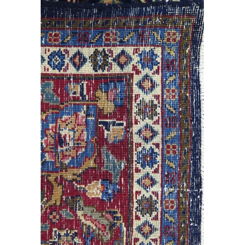 1336 - A Persian Mood carpet, with central field with ivory and wine red pole medallion and all over flower... 