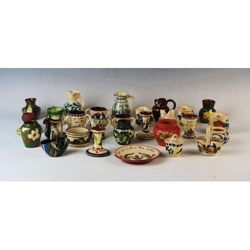 1222A - A collection of Aller Vale and Torquay miniature wares, includes; candlestick, dish, jugs, match str... 