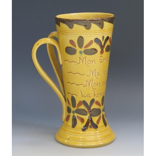 1255 - A Torquay pottery twin handled mug, inscribed with flowerhead Kerswell Daisy decoration (French mott... 