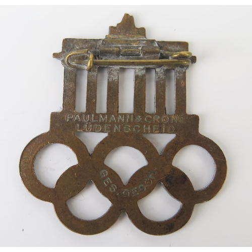 1012 - A Third Reich period 1936 Olympic Visitor's Badge, with enamel decoration, stamped to the reverse Pa... 