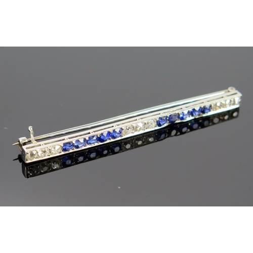 102 - A Sapphire and Diamond Bar Brooch in an unmarked precious white metal setting (prob. platinum), the ... 