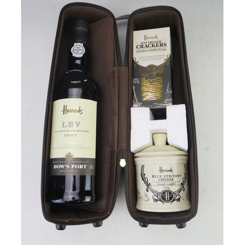 1026 - Harrods, a fitted carrier containing one bottle Harrods LBW Dows Port 2007, together with a stilton ... 