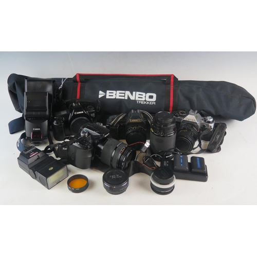 1042A - A collection of assorted 35mm SLR camera and camera equipment including A Canon EOS 1000 camera, Can... 