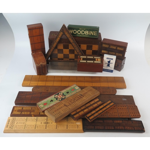 1046 - A collection of treen cribbage boards including a triangular cribbage board, folding chess/backgammo... 