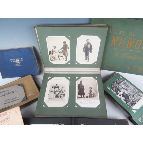 1051 - A collection of Edwardian and later postcards contained in albums, some loose, including actors and ... 