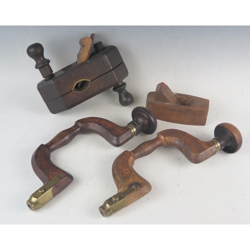 1057 - Two wood and brass mounted braces, a smoothing plane and  a spoke plane