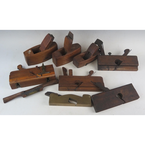 1058 - A collection of seven smoothing and rebate planes, and a spoke shave.