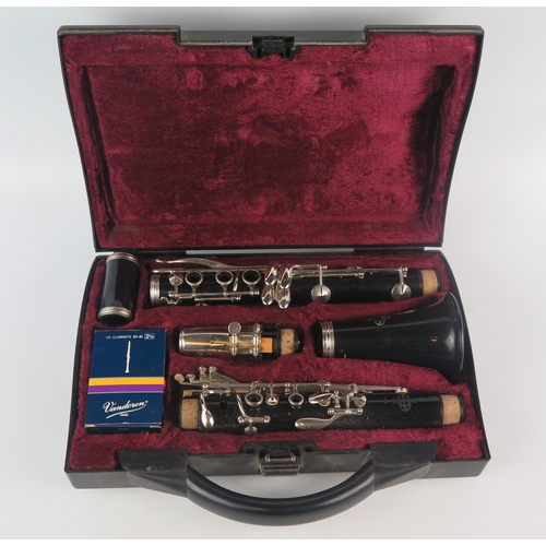 1062 - Buffet, a B12 five piece clarinet, with spare reeds contained in a fitted carrying case