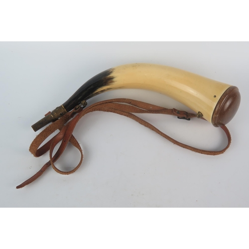 1067 - A Cow horn powder flask with leather strap, 40cm long.