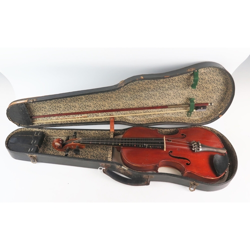 1069 - A Three quarter size violin, the two-piece back of a honey brown varnish. length of back 33.5cm, tog... 