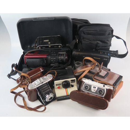 1071 - A JVC VHS video recorder, cased, a Panasonic RX15 video recorder, Triumph folding camera, Agfa Isole... 