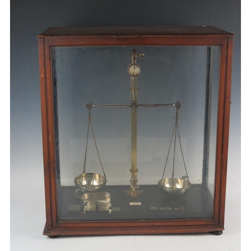 1072B - De Grave & Co, London, a pair of lacquered brass laboratory balance scales, with part set of weights... 