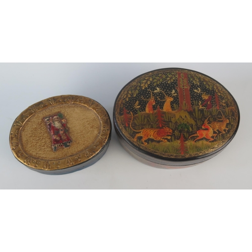 1078 - A Kashmir papier mache and lacquered oval box and cover, the lid decorated with a hunting scene, the... 