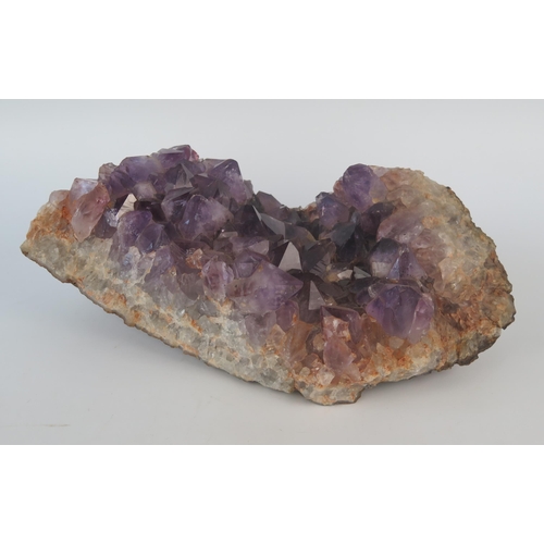 1082 - A section of an amethyst geode, 28cm long.