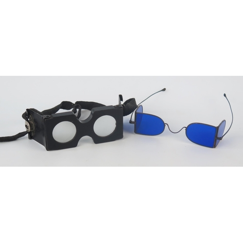 1091 - A pair of steel framed blue tinted sunglasses, together with a pair of folding wood spectacles. (2)