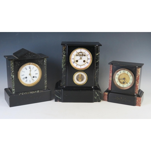 1103 - A late Victorian polished slate mantel clock, of rectangular outline, having a 10cm Roman dial, the ... 