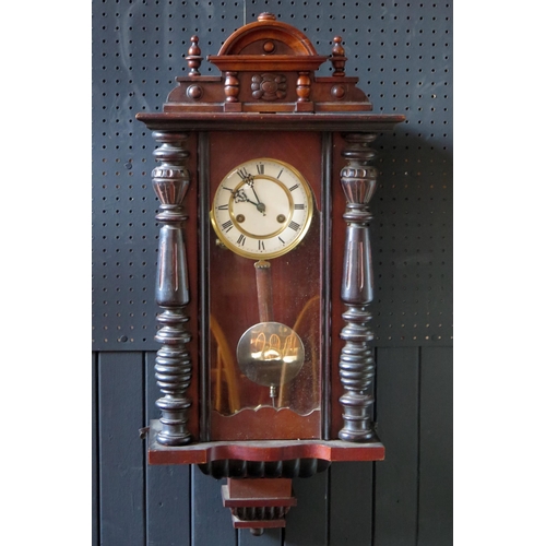 1104 - A Vienna style regulator wall clock the case with arched pediment, turned columns and glazed door, t... 