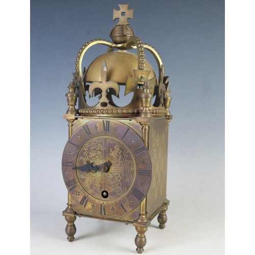 1105 - A George VI coronation period brass lantern clock, with 11.5cm circular Roman dial, centered with Ro... 